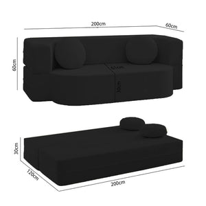 Schwarzes AirBloom Sofa mit zwei runden Kissen aufgestellt und in ein Bett ausgeklappt mit den jeweiligen Massen